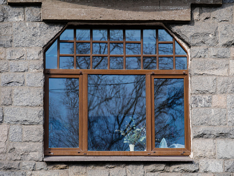 Large window in the old stone building
