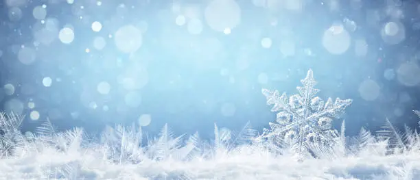 Photo of Snowflake On Natural Snowdrift Close Up - Christmas And Winter Background