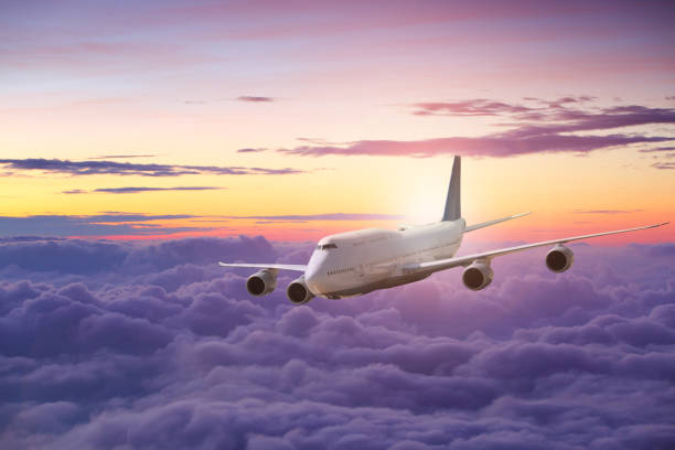istock Big white airplane is flying 1054349812