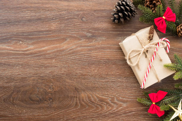 istock Christmas composition background on wood table with gift box and some decorations. Top view with copy space, flat lay. 1054350092