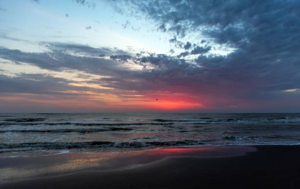 istock Amazing beautiful sunrise at the sea 1054351224