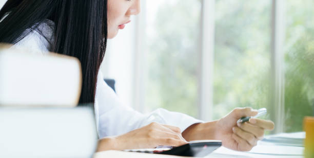 istock Young woman working in modern office 1054358826