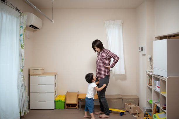 istock Irritated mother and naughty child 1054359042