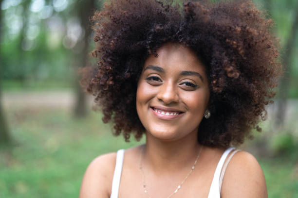 istock Beautiful Woman Portrait at Park 1054360196