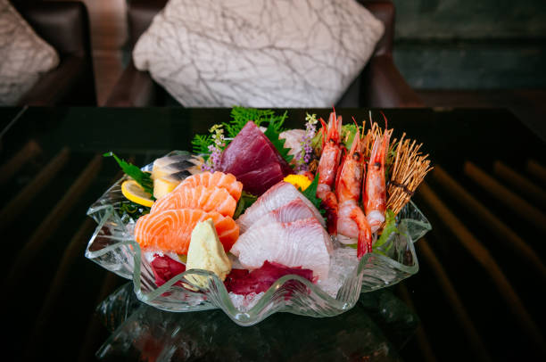 istock Premium sashimi on ice, Tai fish sashimi, Ebi sashimi, Maguro sashimi, salmon sashimi 1054361246