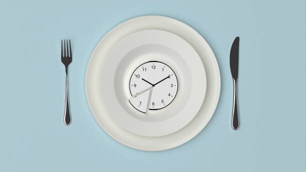 istock Dish with a sliced clock on a pastel blue background 1054363386