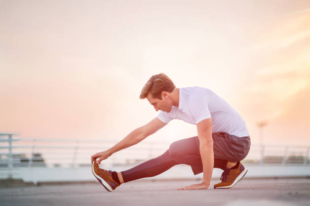 istock Young man exercising outdoors 1054366622
