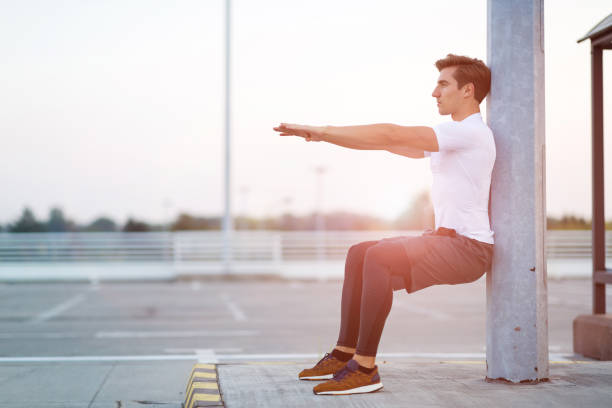 istock Young man exercising outdoors 1054366638