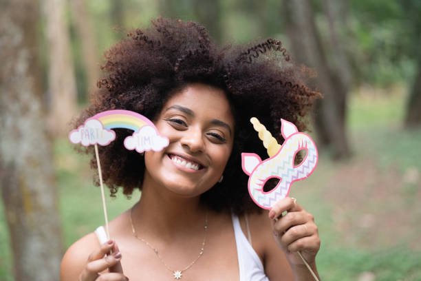 istock Woman having fun with props at park 1054368868