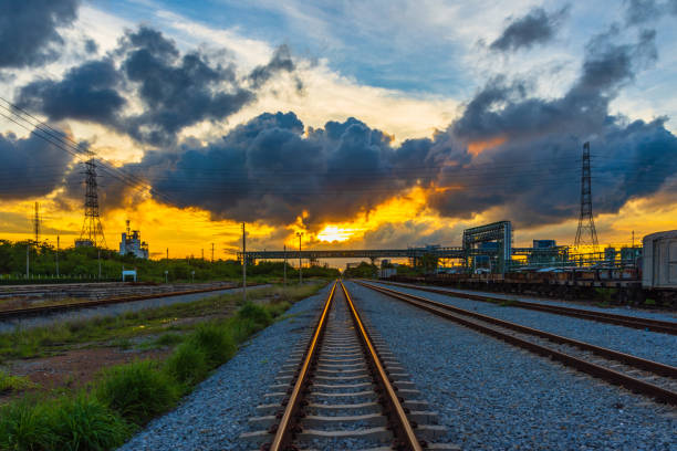 istock Evening at train station and train with wagons. 1054369286