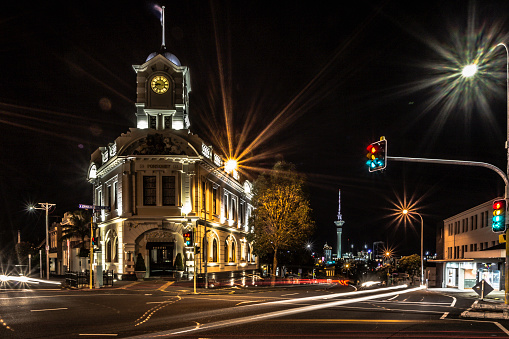This is a picture of Ponsonby's most iconic building with the Auckland Sky Tower in the background, which is Auckland City's most iconic building. This picture was taken at night.