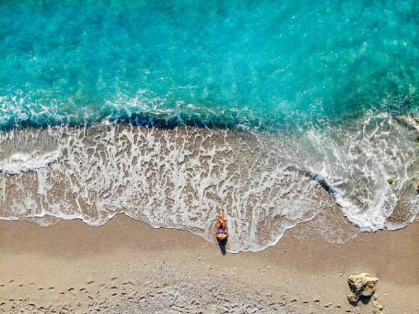 istock Women is among the waves. 1054373344