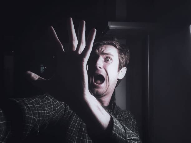 Close-Up Of Scared Mature Man At Home