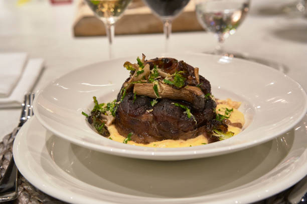 ossobuco dish ready to eat - steak plate gourmet beef imagens e fotografias de stock