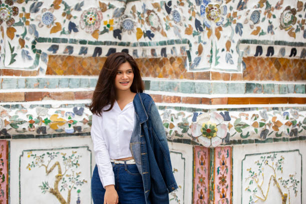 istock Young Woman Standing In City 1054380360