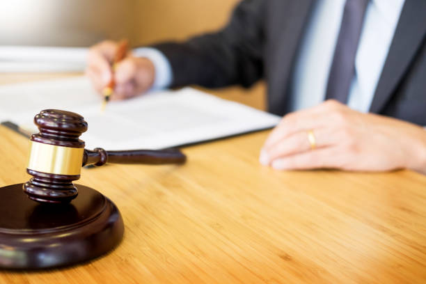 istock Midsection Of Lawyer Working At Office 1054382514