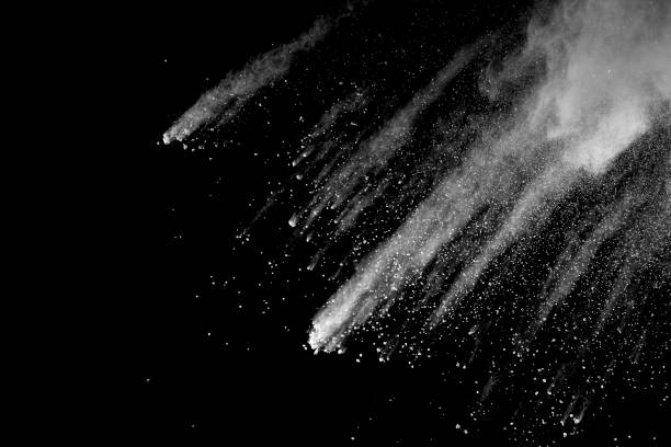 istock Explosion of white dust on black background. 1054385590