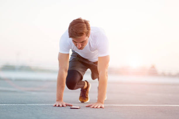 istock Young man exercising outdoors 1054385684