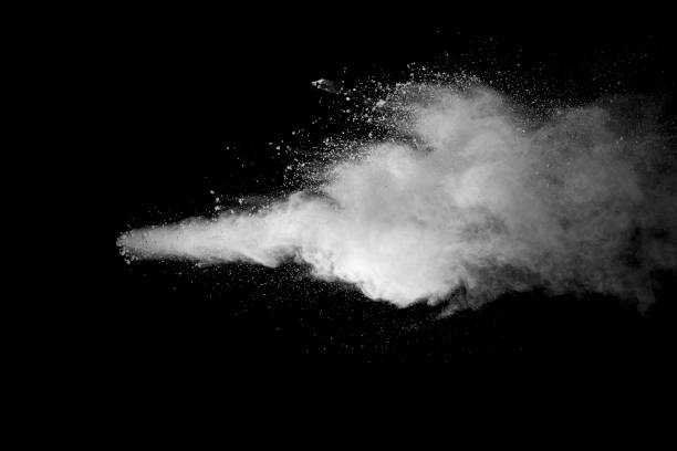 istock Explosion of white dust on black background. 1054386026
