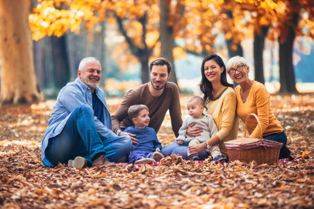 istock Multl generation family in autumn park having fun 1054388958