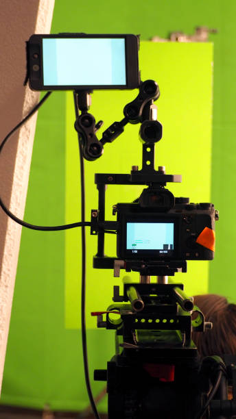 istock Behind the vdo camera in studio production that shooting or filming green screen background 1054389384