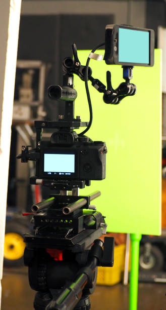 istock Behind the vdo camera in studio production that shooting or filming green screen background 1054389394