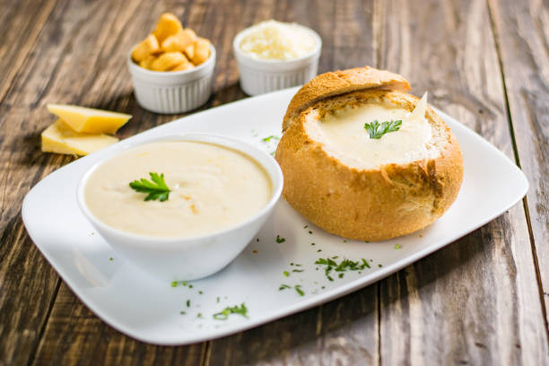 istock Homemade cheese cream soup, served in bread bowl 1054398054