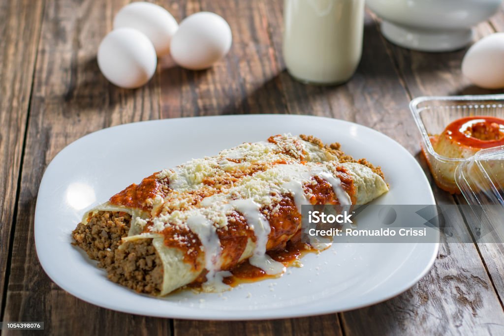 pancakes with meat and tomato sauce Delicious sliced pancakes with meat and tomato sauce Pancake Stock Photo