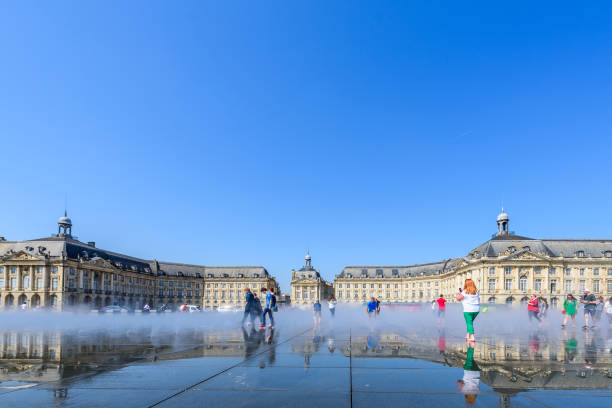 Bordeaux, France - April 9th, 2024: People in front of the Grand Theater de Bordeaux. The theater is home to the Opera National de Bordeaux and the Ballet National de Bordeaux