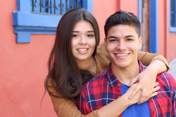 istock Young couple cuddling close up 1054400956