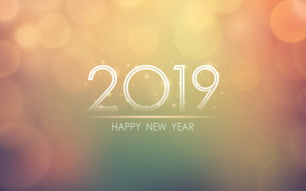 istock Happy new year 2019 with abstract bokeh and lens flare pattern in vintage color style background 1054402998
