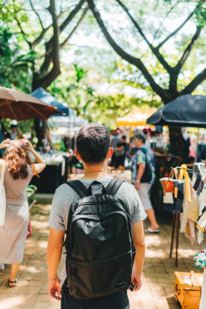 istock men walking in outdoor market 1054413696