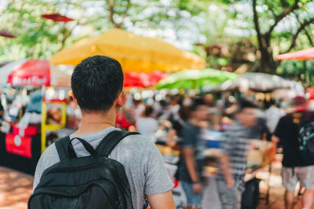 istock men walking in outdoor market 1054413784