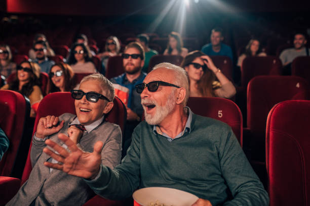 istock Smiling couple watching 3D movie 1054416246