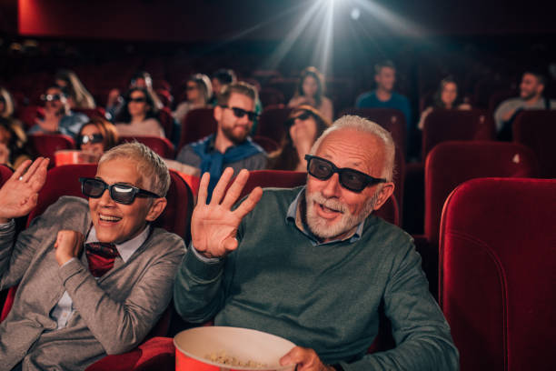istock Old couple watching 3D movie 1054416290