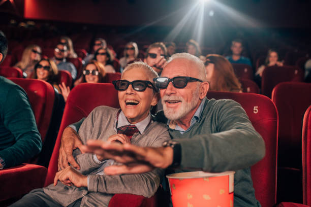 istock Hugging couple with 3D glasses at cinema 1054416294