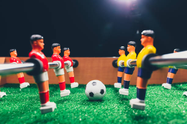 istock table football soccer kicker game players 1054427754