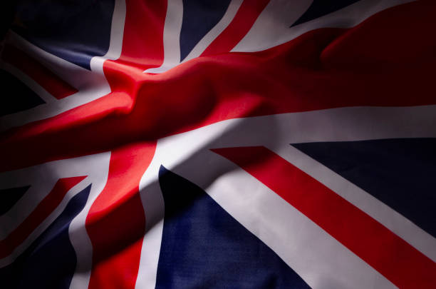 istock The Union Jack flag of Great Britain in shadow 1054429574