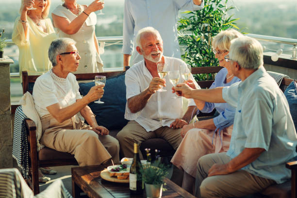istock Senior Friends On Rooftop Party 1054443940
