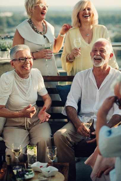 istock Senior Friends On Rooftop Party 1054444028