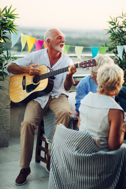 istock Senior Friends On Rooftop Party 1054444100