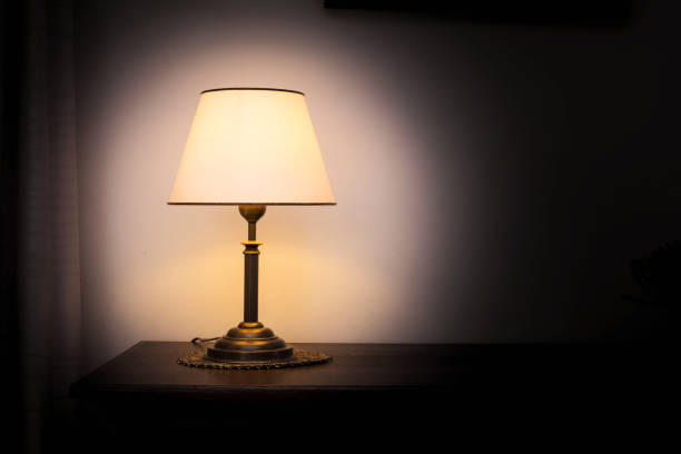istock Lamp night light in a dark background. Vintage effect style picture. Minimal concept. 1054449216