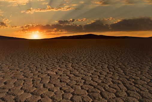 Sunset over a deserted dry land in Namibia