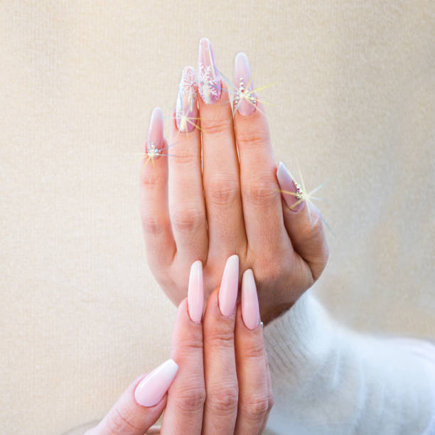 istock nails with pink Christmas decorations 1054449814