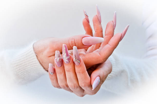 istock nails with pink Christmas decorations 1054451812
