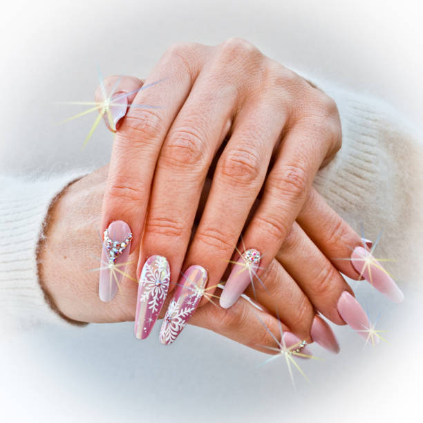 istock nails with pink Christmas decorations 1054454804