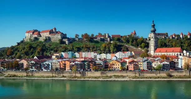 Burghausen, Bavaria, Germany: 180 degree panorama of the old town of Burghausen. View from Austria over the border river Salzach in late summertime.