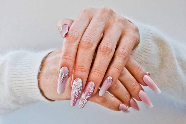 nails with pink Christmas decorations nails with pink decorations to celebrate Christmas and New Year's party christmas nails stock pictures, royalty-free photos & images