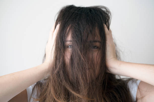 istock Upset woman with messy hair 1054463852