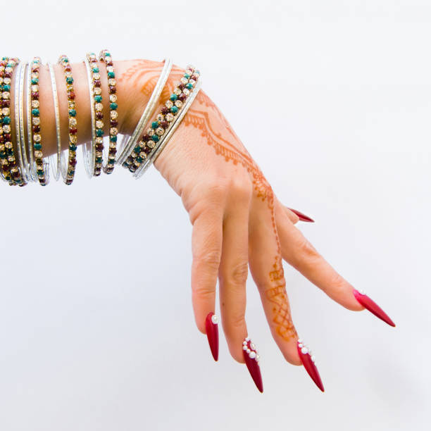istock nails decorated with brilliant and hand with henna tattoos 1054470534